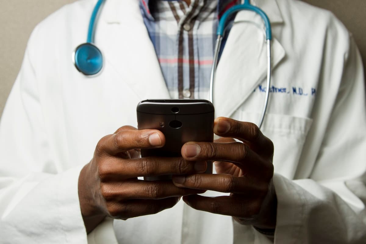 Doctor and patient reviewing health data on a tablet